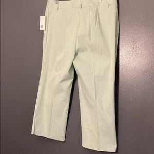 Womens light weight capri’s in a green and white stripe sear sucker type capri.